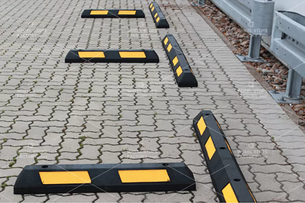 Several parking blocks are installed in the public car park to avoid collisions between cars