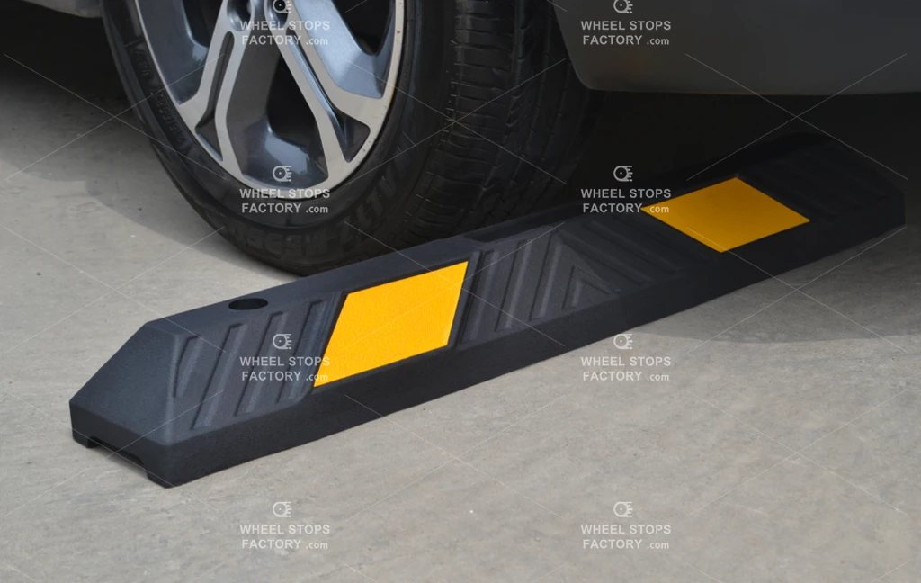 A 3-feet wheel stop with yellow reflective films manufactured by Wheel Stops Factory.