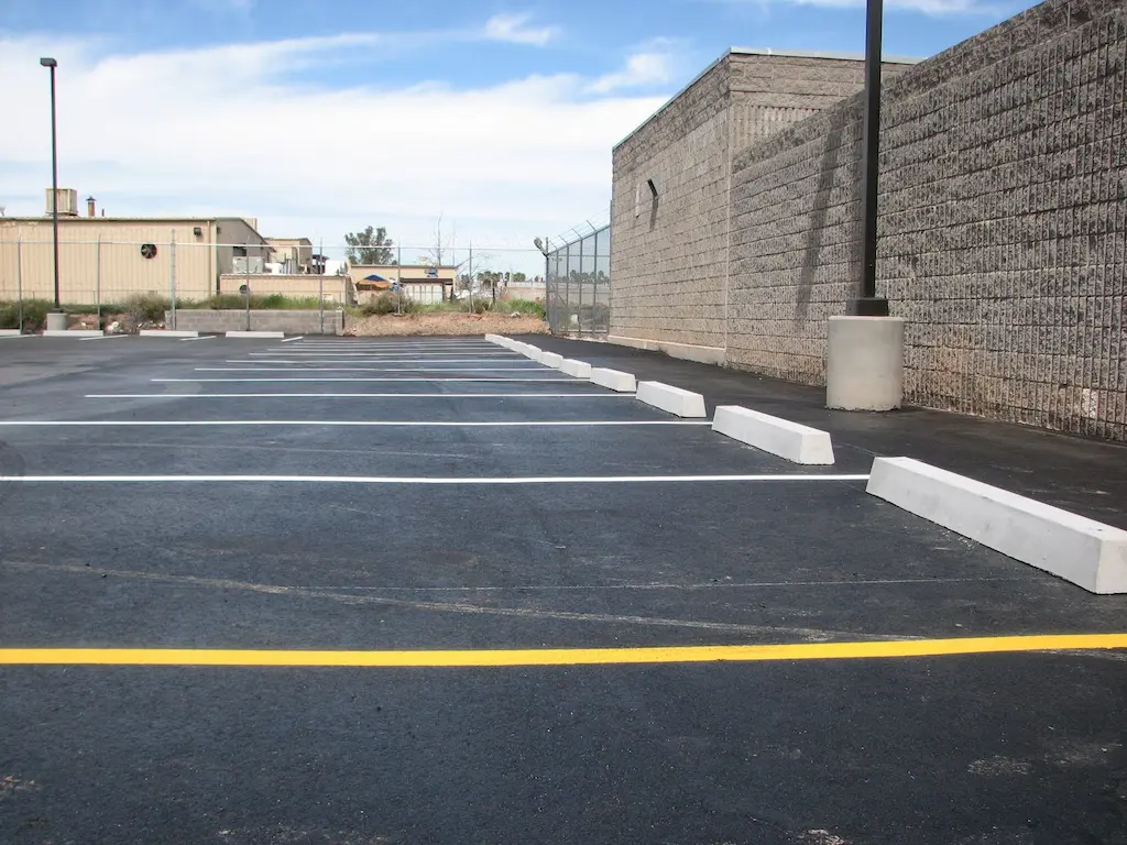 Concrete parking blocks used to enhance parking safety.