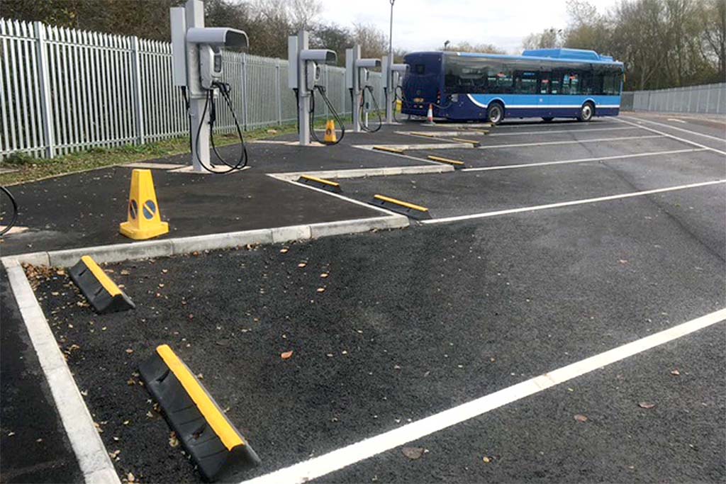 Black and yellow HGV wheel stops used for car park management.